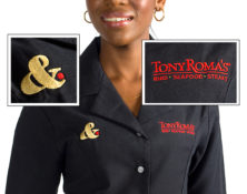 Women's fitted shirt with embroidered corporate logo for restaurant/hospitality industry